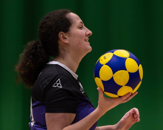Reading Rooks girl holding ball Female Reading Rooks korfball player preparing to shoot at the korf during training