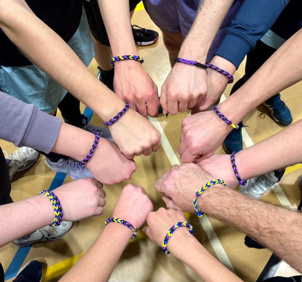 Reading Rooks Korfball members bought some bracelets for a charity
